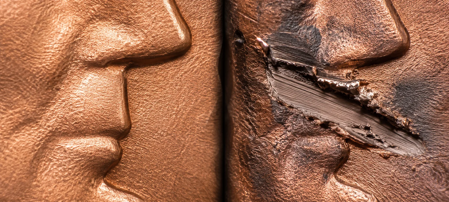 Split macro comparing crisp minted relief against torn and gouged metal under identical light